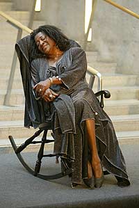 Dr Stewart performs in a rocking chair 