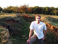 Dan Snow, presenter of the acclaimed BBC series Battlefield Britain, standing in trench