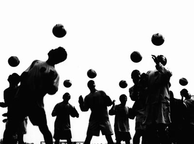 Students at a Chinese football club school practice. 